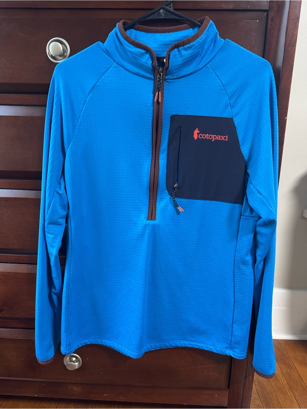 cotopaxi Blue Half-Zip Pullover with Navy Pocket and Brown Trim